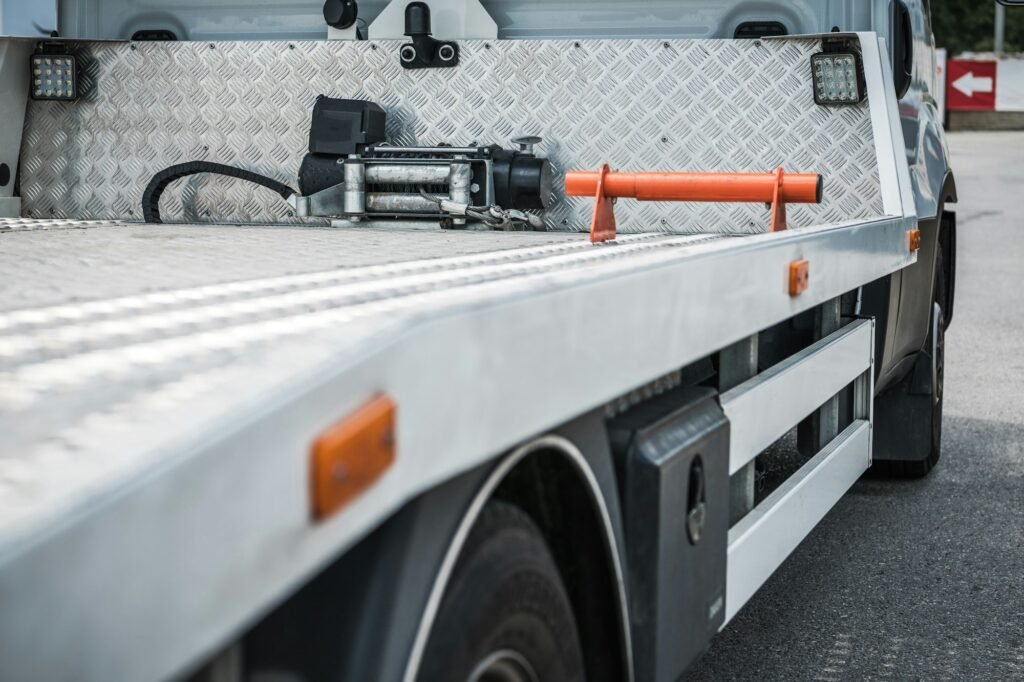 Side Rear of Empty Mid Size Towing Truck