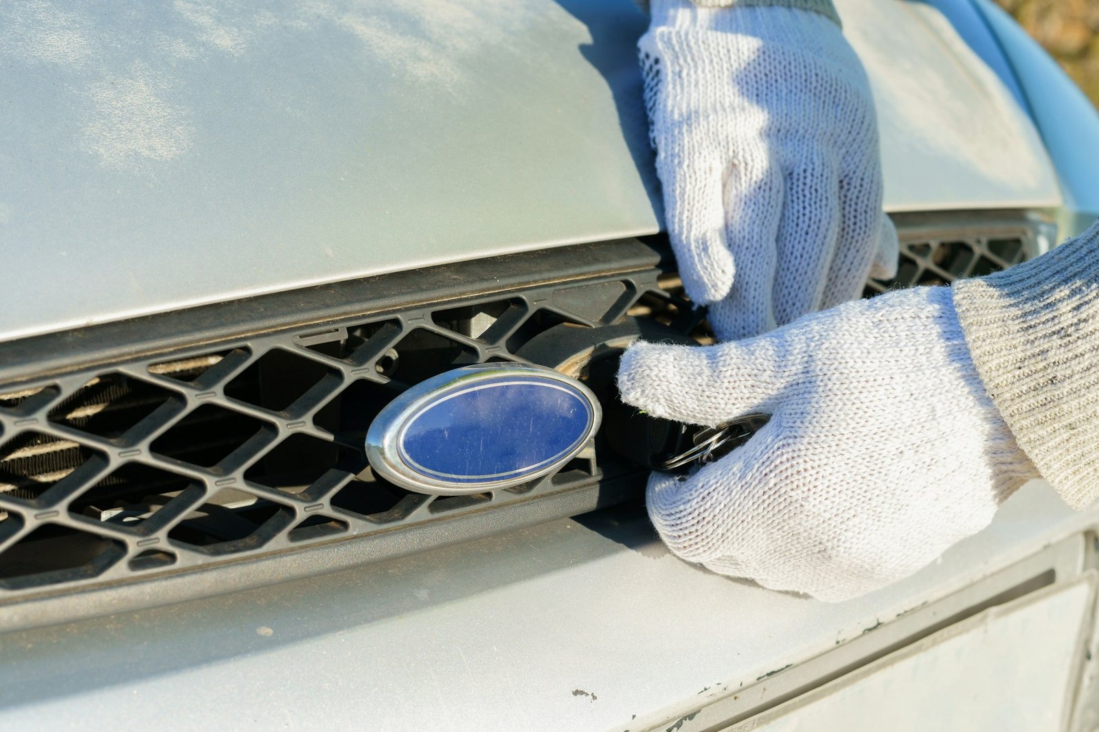 Unrecognizable man opening car hood